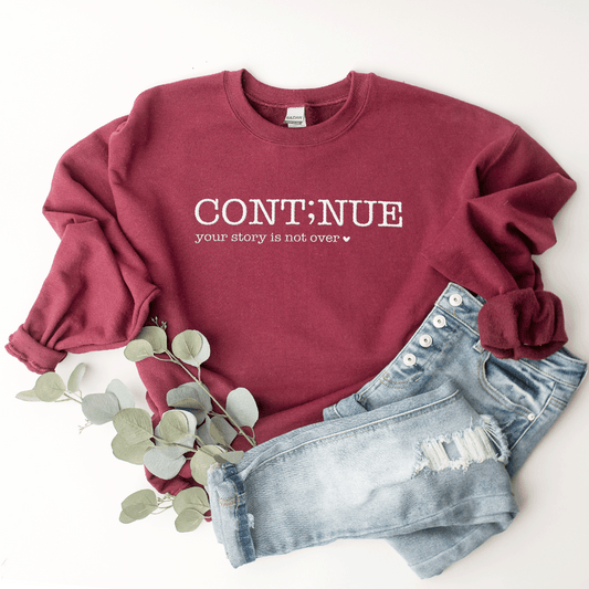 Continue. Your Story Isn't Over - Sweatshirt (Embroidered)